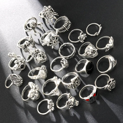 Silver-toned gothic skeleton ring set with intricate skull and spider designs in a 24pcs punk jewelry collection