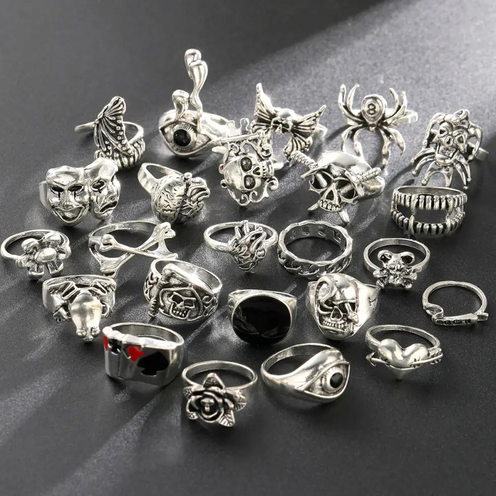 Silver-toned gothic skeleton ring set with skulls spiders masks and roses featuring 24pcs punk jewelry ring set