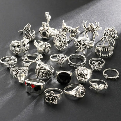Silver-toned gothic skeleton ring set with skulls spiders masks and roses featuring 24pcs punk jewelry ring set