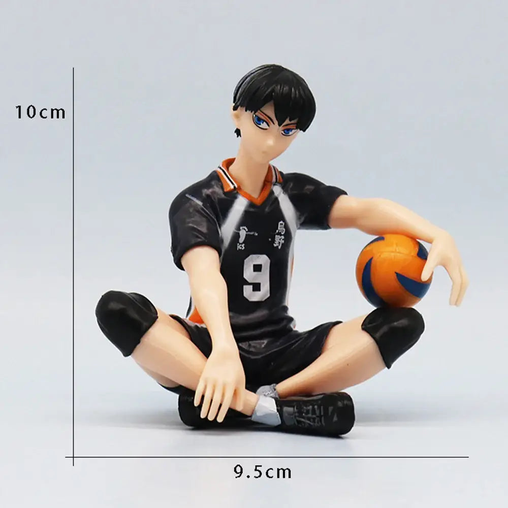 Haikyuu shoyo hinata pvc figure in black and orange sitting cross-legged holding a ball hinata noodle stopper