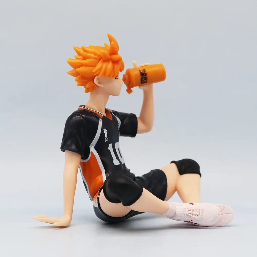 Haikyuu shoyo hinata noodle stopper pvc figure of orange-haired volleyball player sitting drinking from orange bottle
