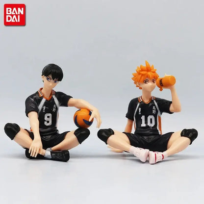 Two black and orange pvc volleyball figures from haikyuu shoyo hinata noodle stopper set with jersey numbers 9 and 10