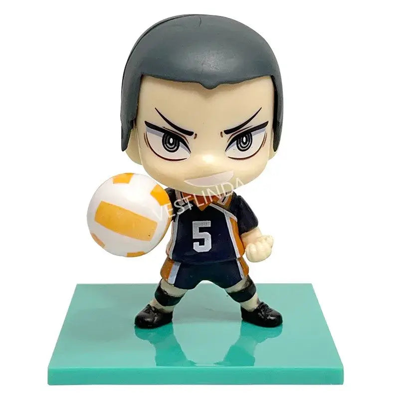 Chibi-style haikyuu shoyo hinata pvc statue with dark gray hair navy blue and orange jersey holding orange volleyball