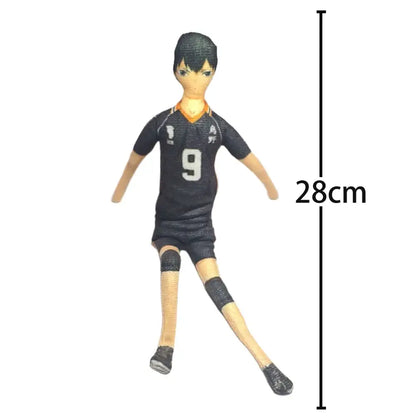 Black vinyl figure of tobio kageyama in dynamic volleyball pose wearing jersey number 9 with orange trim and black shorts