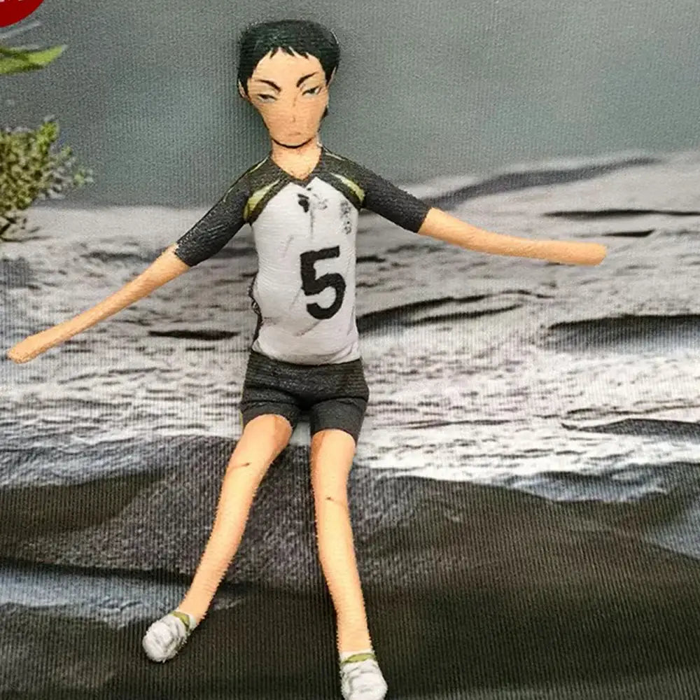 A small handcrafted plush doll of tobio kageyama in a white jersey with black sleeves and number 5 on the front
