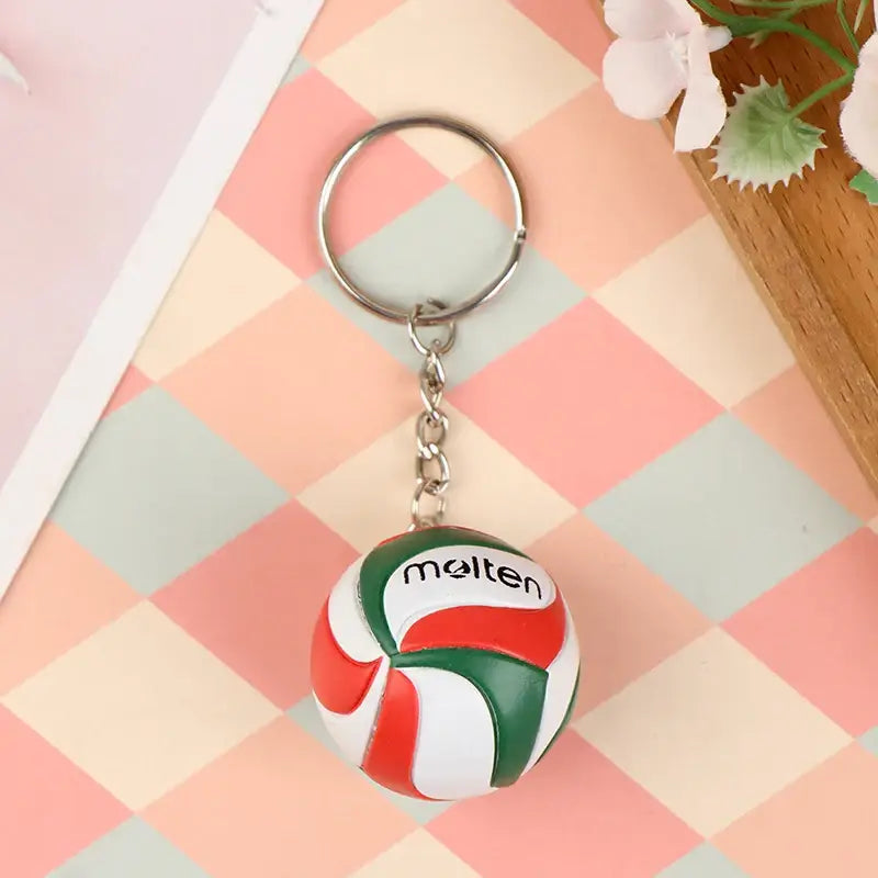 Haikyuu volleyball keychain featuring a red white and green pvc molten volleyball with a silver metal ring and chain