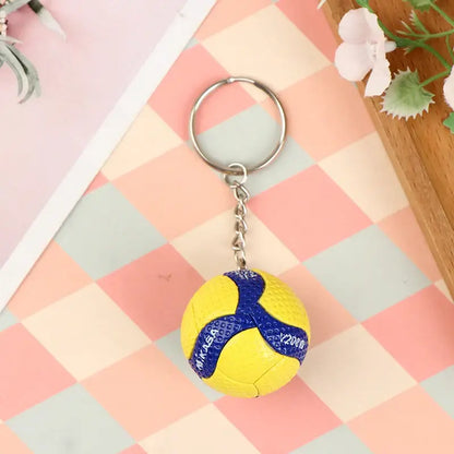 Yellow and blue mikasa pvc volleyball keychain with textured surface haikyuu pvc ornament accessory