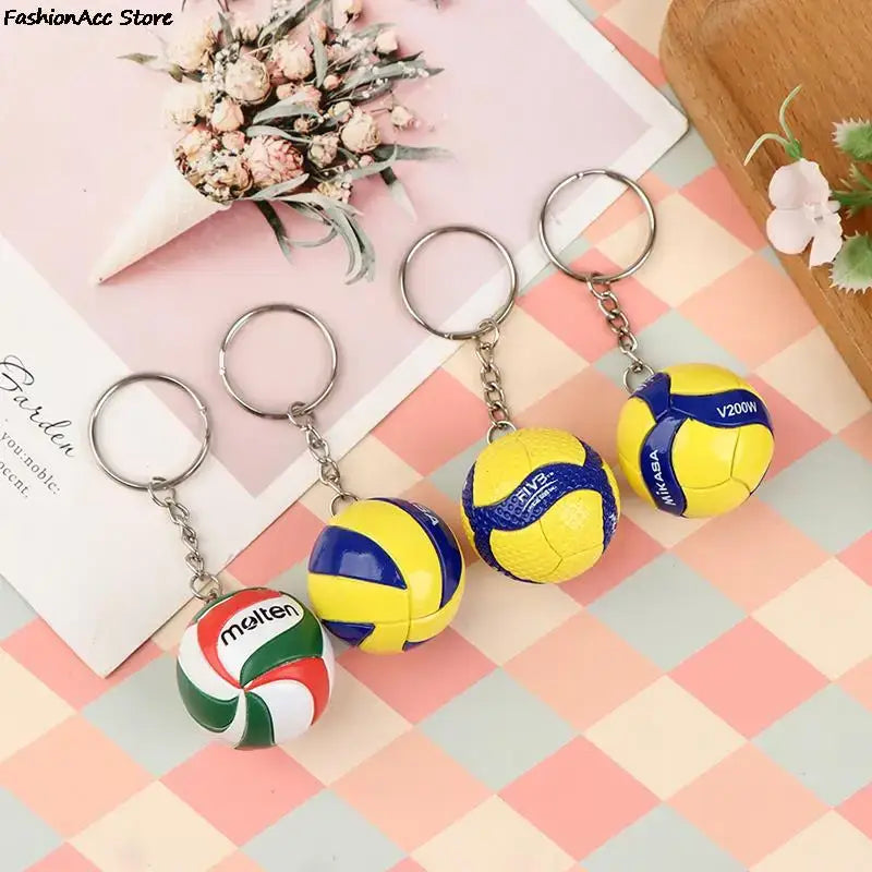 Haikyuu volleyball keychain set with miniature yellow and blue PVC volleyballs and metallic rings for fans