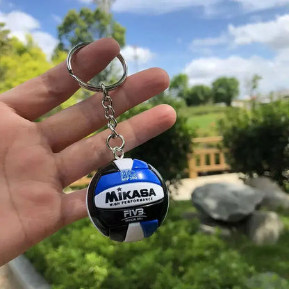 Haikyuu pvc keychain featuring a blue and black mikasa volleyball with white accents volleyball pvc keychain