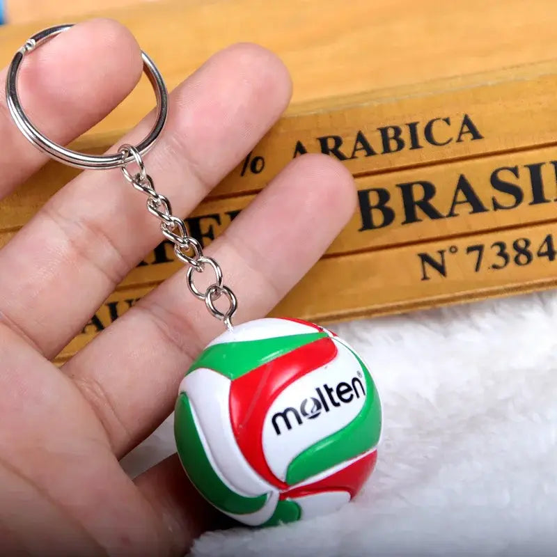Haikyuu volleyball pvc keychain featuring a miniature molten volleyball design in glossy red green and white
