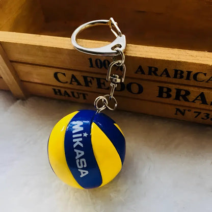 Yellow and blue mikasa volleyball pvc keychain with silver metal ring and chain from haikyuu sport ball design