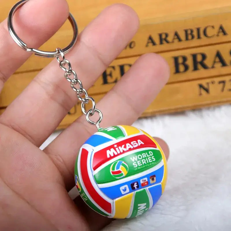 Colorful mikasa volleyball pvc keychain with metallic chain featuring vibrant yellow blue green and red panels