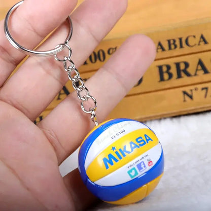 Blue and yellow mikasa volleyball pvc keychain with white panels and silver chain from haikyuu sport ball design