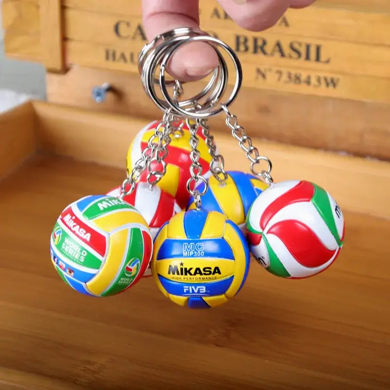 A set of colorful mikasa volleyball pvc keychains featuring vibrant panels and official haikyuu branding in sport ball design