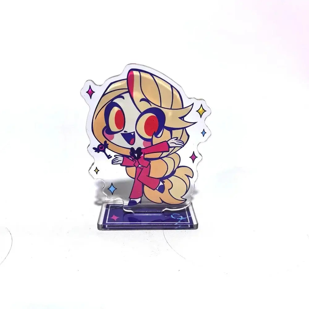 Clear acrylic stand featuring hazbin hotel alastor chibi character with blonde hair red eyes and pink outfit cartoon figure