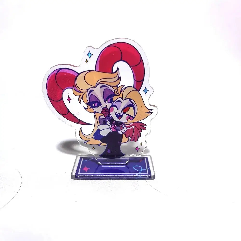 Hazbin hotel alastor acrylic stand featuring two blonde cartoon characters with red horns, one in black dress holding a rose