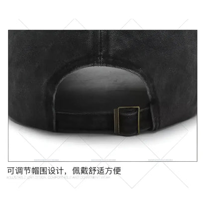 Black denim dad hat with kitty distressed embroidery and brass-colored adjustable strap buckle on the back side