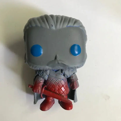 Gray funko pop figure with blue eyes wearing red armor and holding a sword from high quality sword art online toys