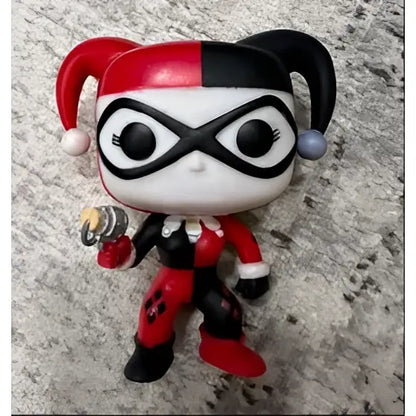 Red and black harley quinn funko pop with jester hat and white mask paired with high quality sword art online figure