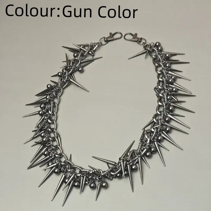 Gun-colored spiked choker necklace with metallic spikes and beads paired with black gun metal biker pants chain