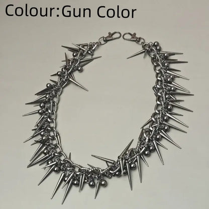 Gun-colored spiked choker necklace with metallic spikes and beads paired with black gun metal biker pants chain