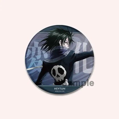 Circular handmade hunter x hunter character pin showing the back with a dark outfit and white skull emblem