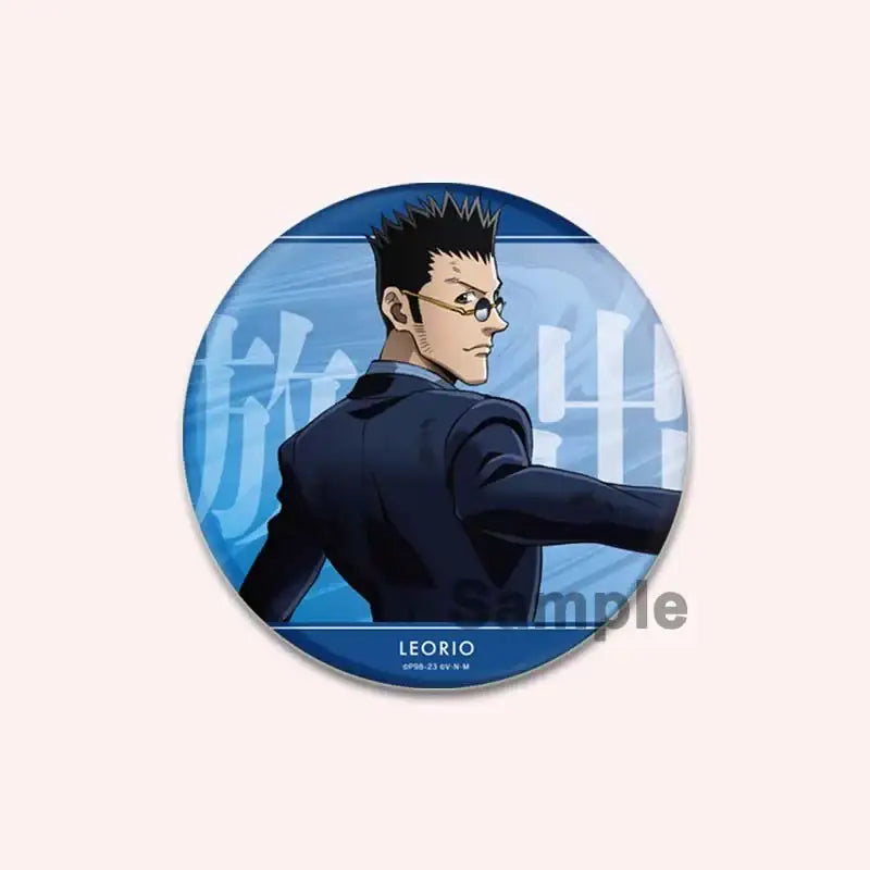 Blue circular hunter x hunter character pin featuring an anime character in a dark suit and glasses handmade badge