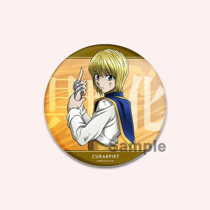 Circular hunter x hunter character pin featuring a blonde anime character wearing a blue cape against gold background