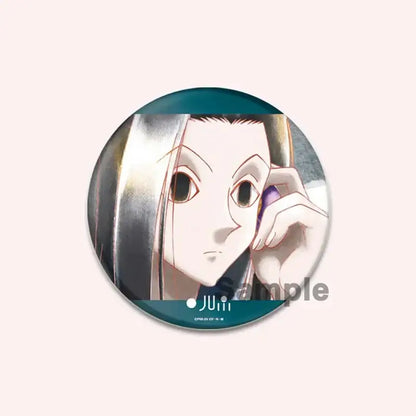 Circular hunter x hunter character pin featuring an anime character with long silver hair holding a purple phone on teal background