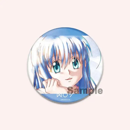 Circular hunter x hunter character pin featuring an anime character with flowing blue hair and turquoise eyes in watercolor style