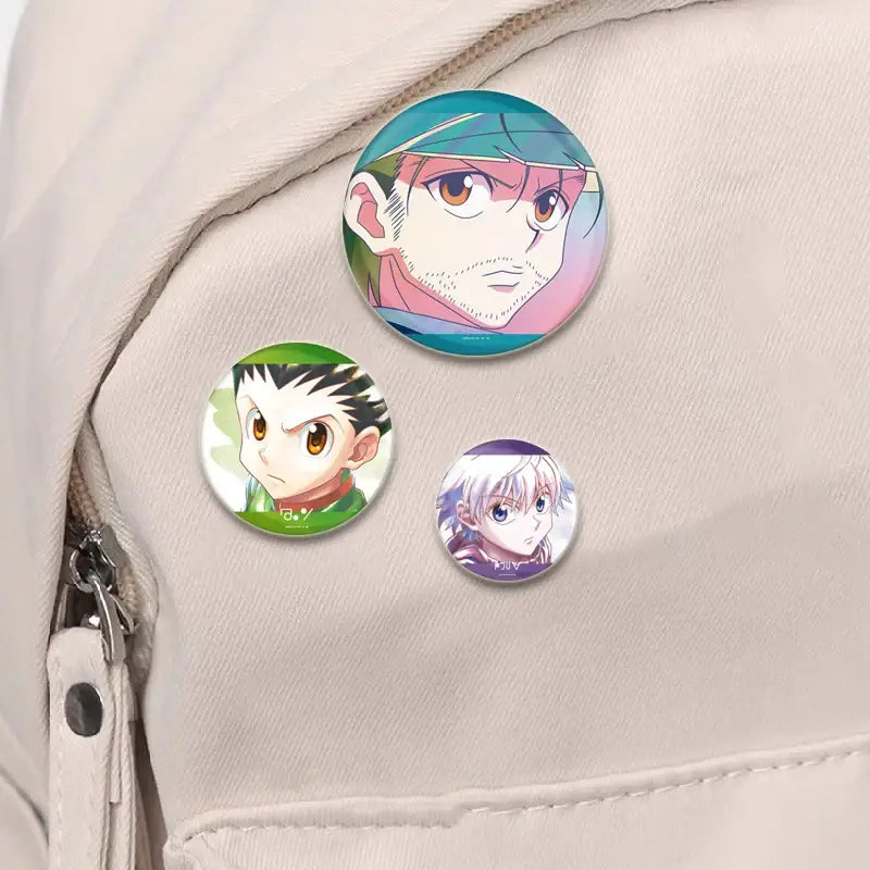 Three vibrant handmade hunter x hunter character pins with glossy finish featuring distinct anime designs