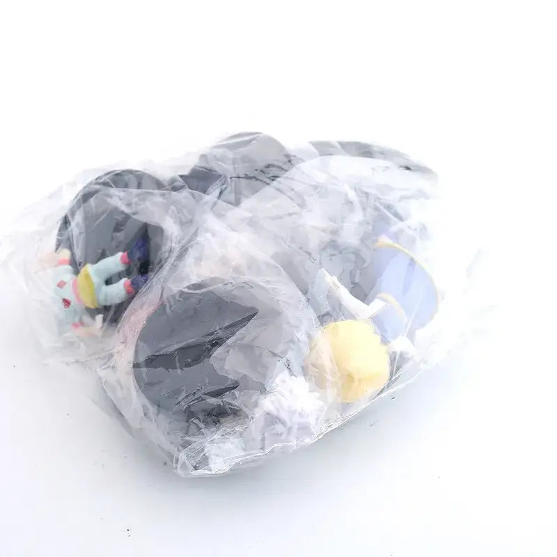 A collection of colorful hunter x hunter gon freecss pvc figures in clear packaging 8pcs set