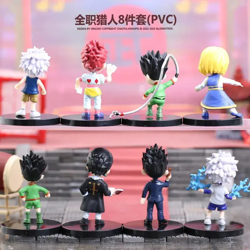 Set of eight hunter x hunter pvc figurines including gon freecss with whip and blue energy in signature poses