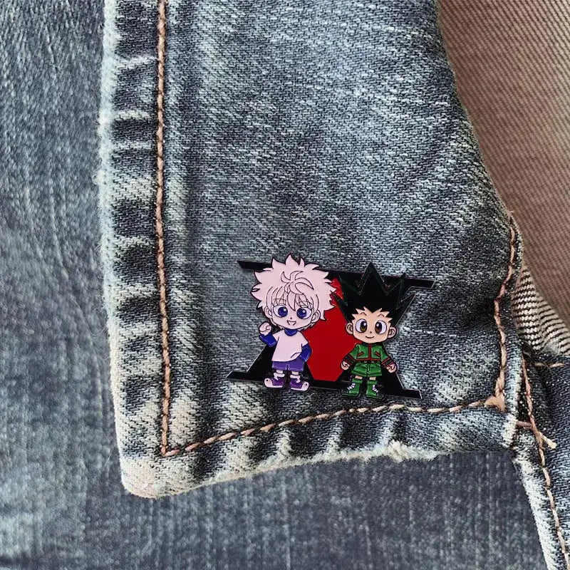 Hunter x hunter enamel pin featuring pink-haired and green-attired cartoon characters on a red background badge