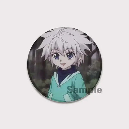 Circular hunter x hunter pin badge featuring anime character killua with spiky white hair and teal jacket