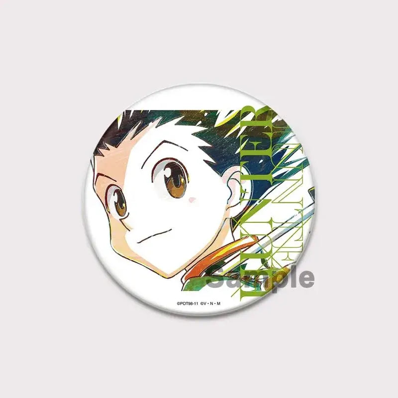 Circular white hunter x hunter pin badge featuring anime character killua with spiky black hair and green orange outfit