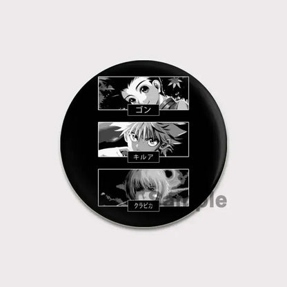 Black circular hunter x hunter pin badge featuring black-and-white manga portraits of gon killua and kurapika