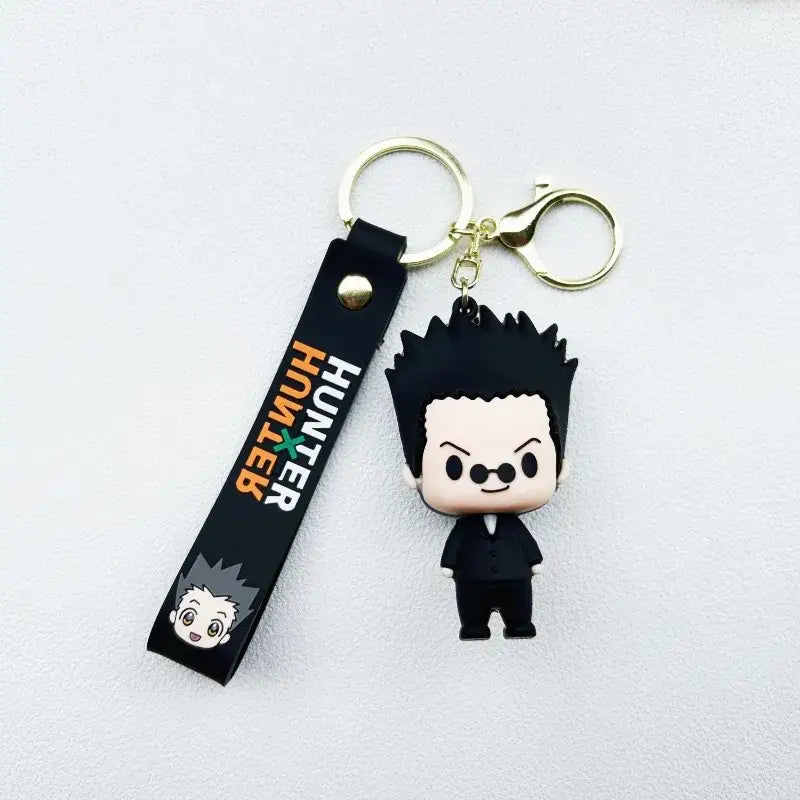 Black rubber hunter x hunter killua keychain resin pendant featuring chibi hisoka morow with spiky hair and glasses