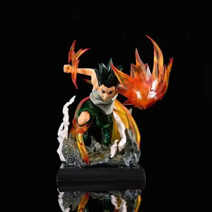 A limited edition hunter x hunter figurine of gon freecss with vibrant orange and yellow flames on a black base