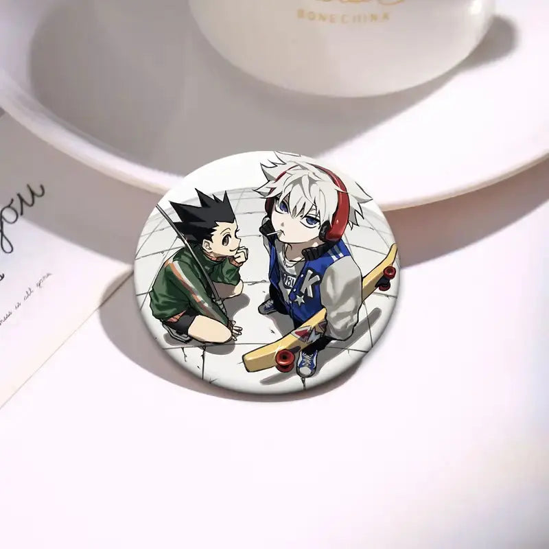 Circular hunter x hunter kurapika brooch pin featuring anime characters with black spiky hair and white hair on tiled floor