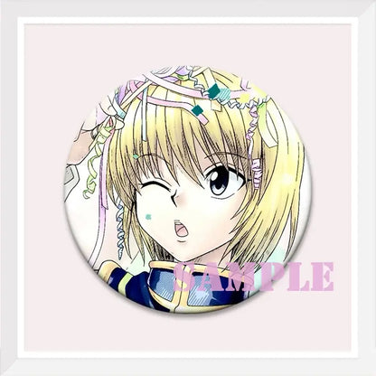 Circular hunter x hunter kurapika brooch pin featuring an anime character with blonde hair and colorful ribbons