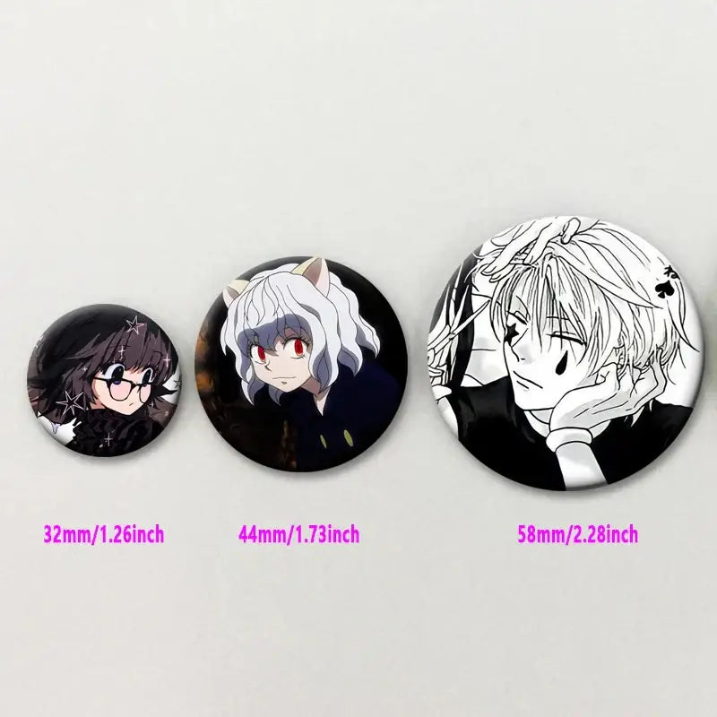Three black and white hunter x hunter kurapika brooch pins in varying sizes featuring round anime character designs