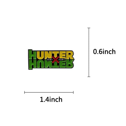 A vibrant green and yellow hunter x hunter logo brooch enamel pin featuring japanese text fantasy adventure badge