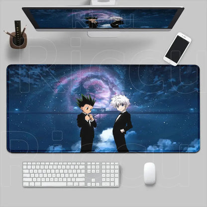 Long rectangular hunter x hunter mouse pad with two anime characters in black suits on a cosmic desk mat