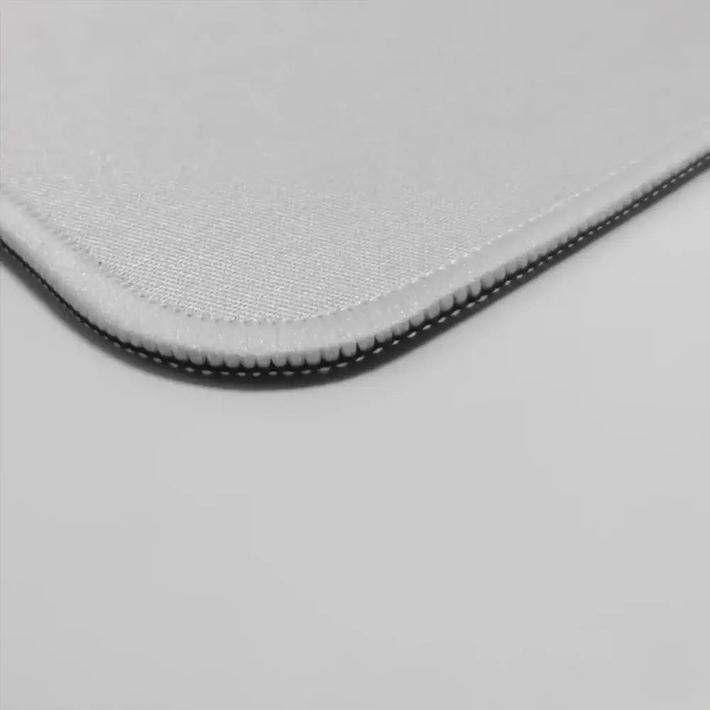 Hunter x hunter mouse pad in light gray fabric with subtle texture and stitched edges featuring a black zipper trim