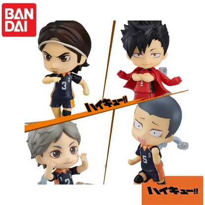 Chibi-style vinyl figurines of haikyuu characters in navy blue and orange uniforms by bandai with detailed expressions