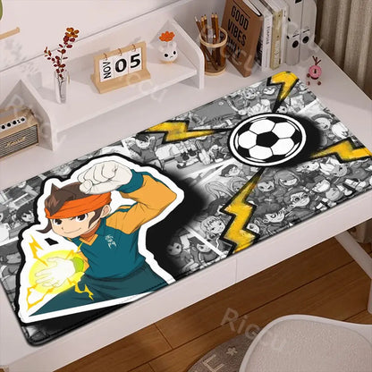 Inazuma eleven desk mat in black gray and yellow with a character in an orange headband on a rubber anti slip mouse pad