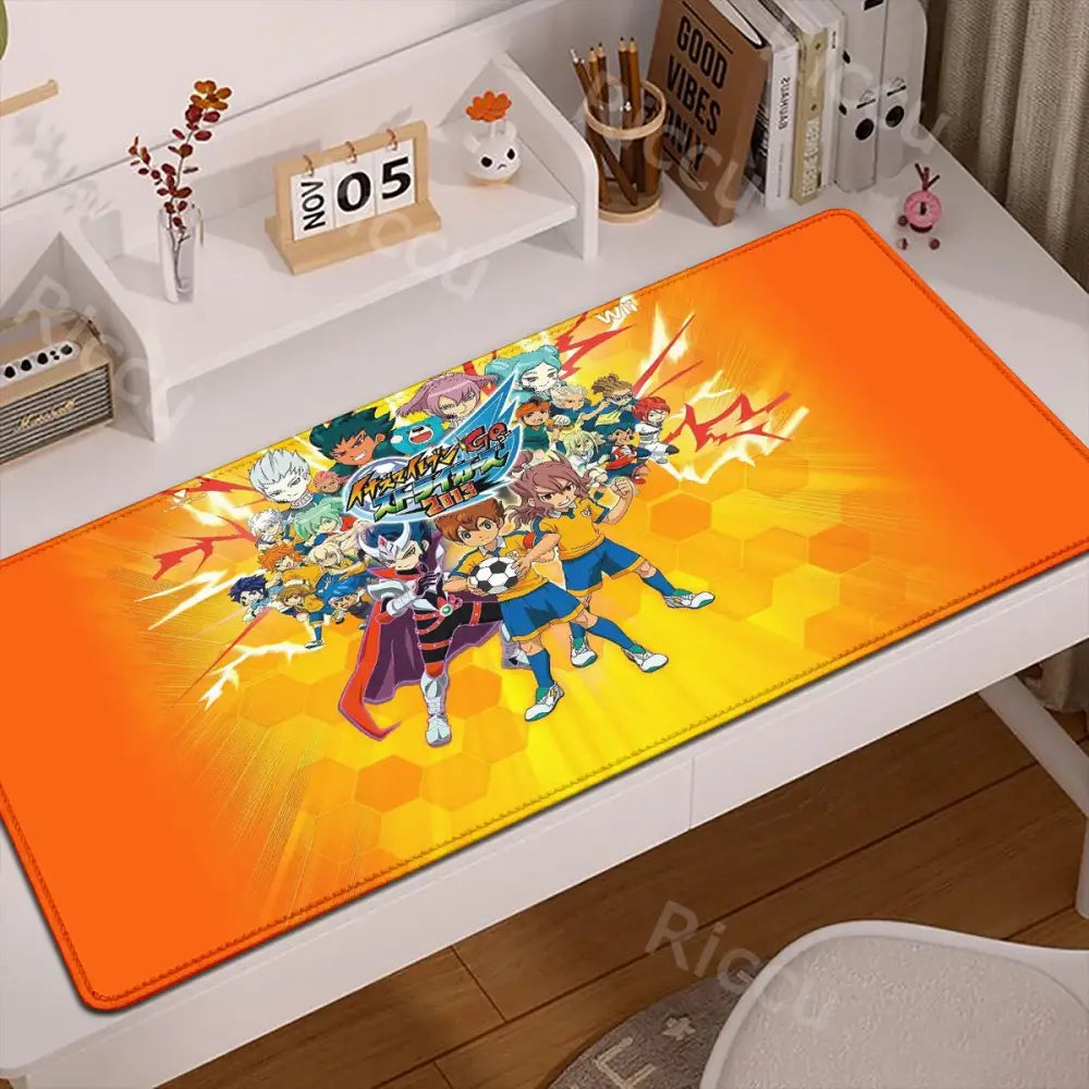 Vibrant orange and yellow inazuma eleven desk mat with dynamic anime soccer design and anti-slip rubber backing mouse pad