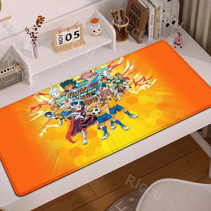 Vibrant orange and yellow inazuma eleven desk mat with dynamic anime soccer design and anti-slip rubber backing mouse pad