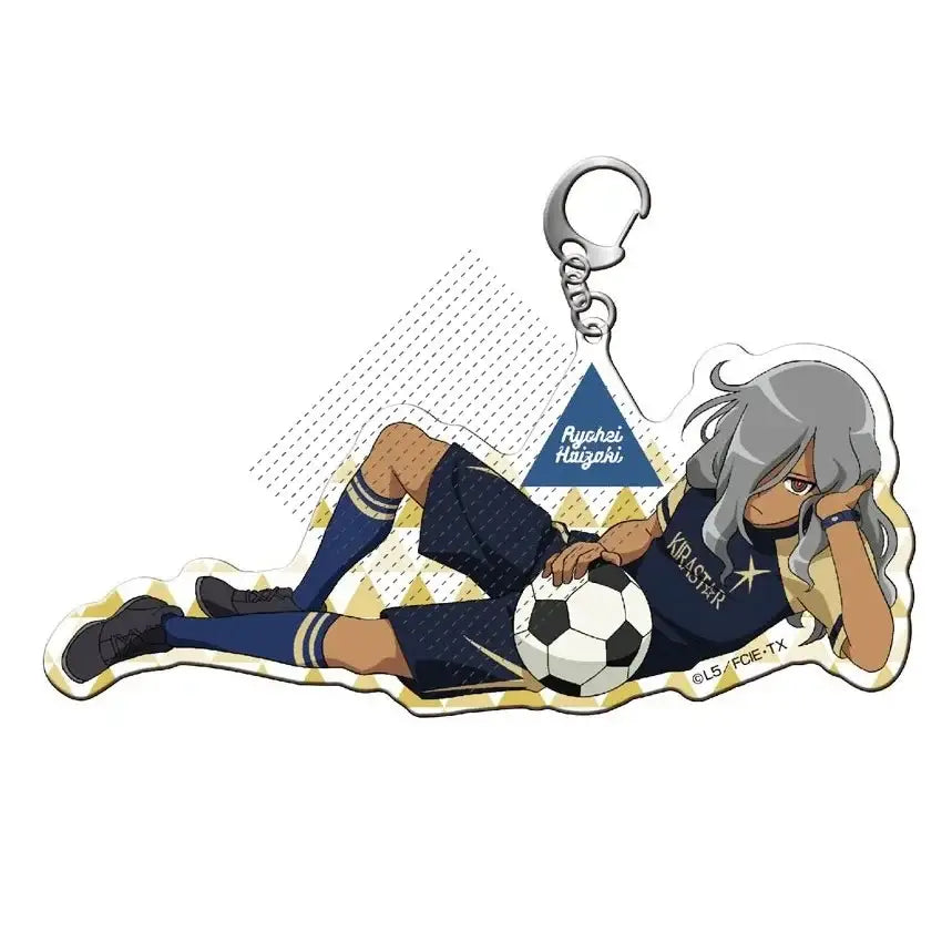 Silver shuya goenji acrylic keyring with navy blue soccer uniform design and classic black and white soccer ball detail